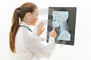 Doctor working with x ray film of patient head.