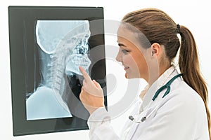 Doctor working with x ray film of patient head.