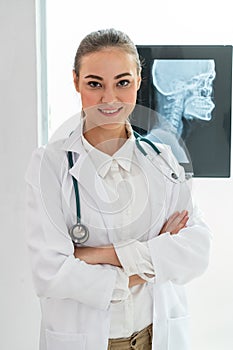 Doctor working with x ray film of patient head.