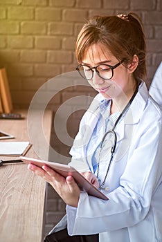 Doctor working on tablet