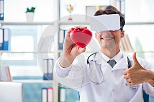 The doctor working with virtual vr reality glasses
