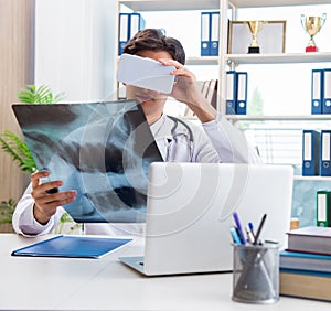 Doctor working with virtual VR reality glasses