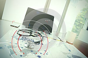 Doctor workspace with laptop computer in medical workspace office and medical network media diagram as concept