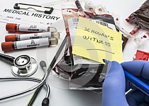 Doctor writes Jehovah`s Witness note, concept of denial of blood transfusions, conceptual image