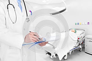 Doctor writing a medical prescription in delivery room