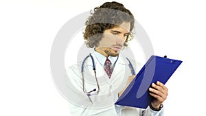 Doctor writing medical report in patient's clinical history, prescribing drugs
