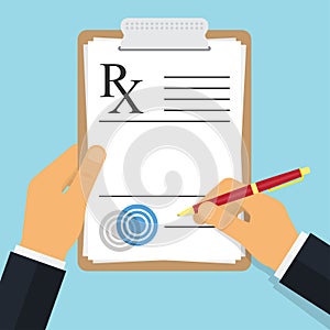 Doctor writing notes on a prescription pad photo