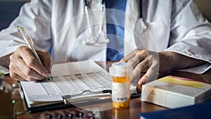 Doctor writing patient notes on a medical examination