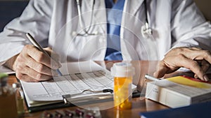 Doctor writing patient notes on a medical examination