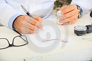 Doctor writing a perscription