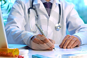 Doctor writing prescription photo