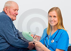 Doctor Writing Prescription For Elderly Patient