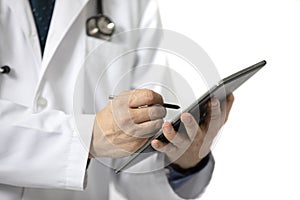 doctor writing on a tablet