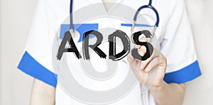 Doctor writing text ARDS with marker, medical concept