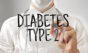 Doctor writing word DIABETES TYPE 2 with marker, Medical concept