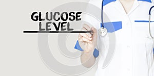 Doctor writing word Glucose Level with marker, Medical concept