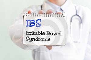 Doctor writing word IBS Irritable Bowel Syndrome with marker, Medical concept