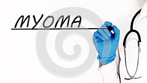 Doctor writing word MYOMA . Medical concept on white background