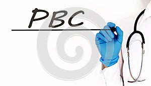 Doctor writing word PBC Medical concept on white background