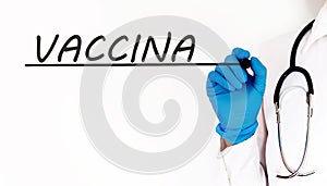 Doctor writing word VACCINA Medical concept on white background