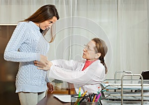 Doctor with young female patient