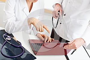 Doctors analysing computer documents