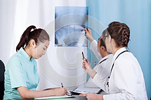 Doctors analyzing x-ray