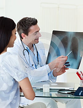 Doctors analyzing an x-ray photo
