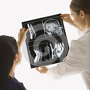 Doctors analyzing x-ray. photo