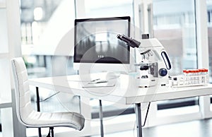 Doctors aways use the right equipment. a desk with scientific equipment on it inside of a laboratory.