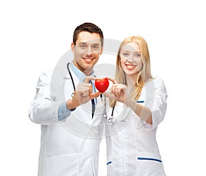 Doctors cardiologists with heart
