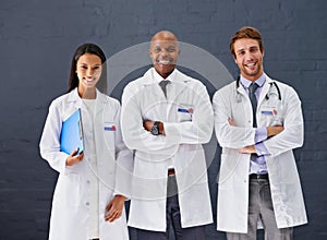 Doctors, coat and portrait for hospital healthcare service, medical treatment and wellness for professional care. Expert