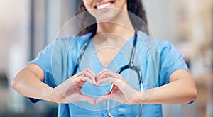 Doctors dedicate their lives to taking care of others. an unrecognizable doctor making a heart gesture with their hands