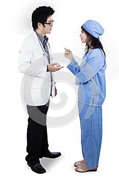 Doctors discussing while standing