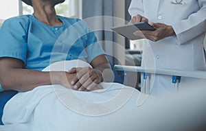 Doctors do it for the health of it. Shot of a mature doctor examining his patient who is concerned about his knee