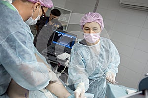 Doctors doing vein surgery procedure