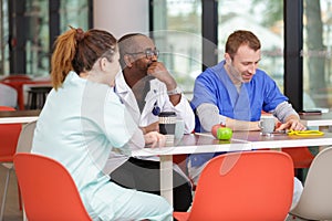 doctors eat as team in cafeteria