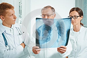 Doctors examine x-ray image