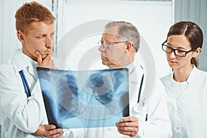 Doctors examine x-ray image in hospital