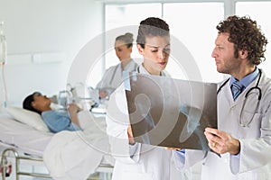 Doctors examining Xray in hospital