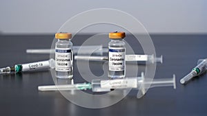 Doctors Grabbing Vials of COVID-19 Vaccine