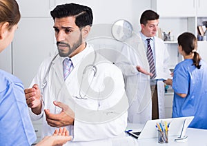 Doctors having discussion in medical office