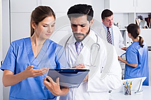 Doctors having discussion in medical office