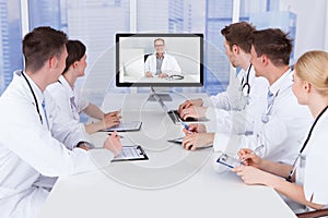 Doctors having video conference meeting in hospital