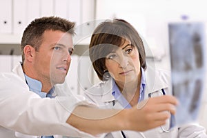 Doctors looking at x-ray image