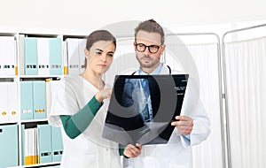 Doctors looking at x-ray in medical office