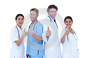 Doctors and nurse gesturing thumbs up
