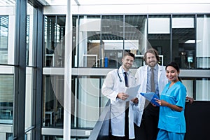 Doctors and nurse holding medical reports