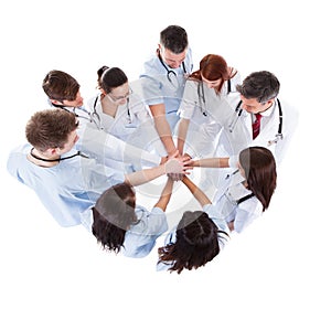 Doctors and nurses stacking hands