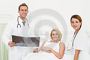 Doctors and patient with x-ray in hospital